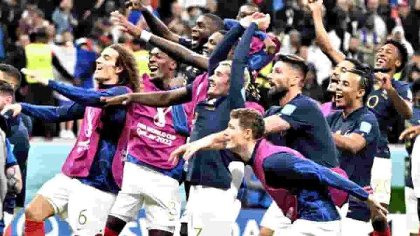 French players celebrate at the end of the World Cup quarter final football match between England and France