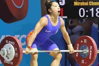India's weightlifter Saikhom Mirabai Chanu attempts a lift during the Women's 49 Kg weightlifting match