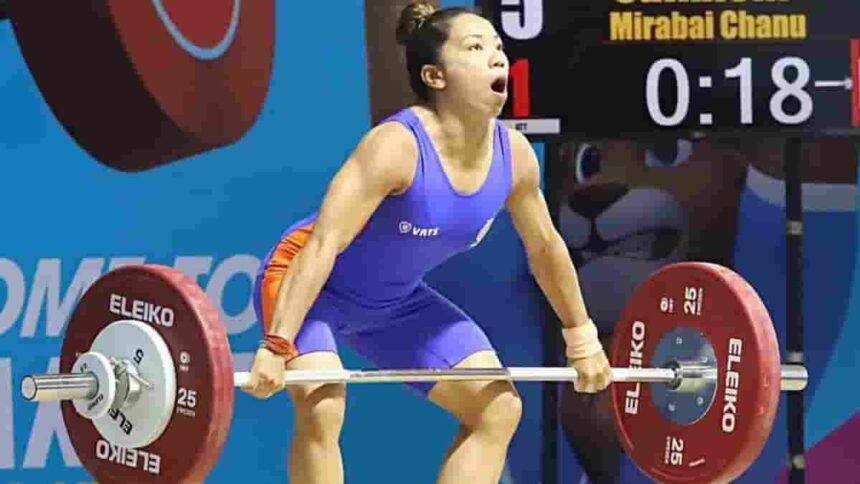 India's weightlifter Saikhom Mirabai Chanu attempts a lift during the Women's 49 Kg weightlifting match