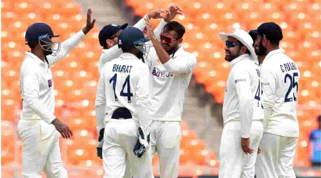 India's Axar Patel celebrates with teammate the dismissal of Australia's Travis Head during the fifth day of the fourth cricket test (PhotoRaj KumarIANS)