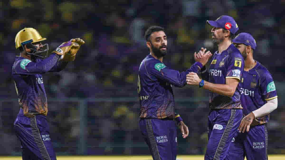 Kolkata KKR bowler Varun Chakaravarthy with teammates celebrate the dismissal of CSK's Devon Conway during the IPL 2023 match between Chennai Super Kings and Kolkata Knight Riders (PhotoIANS)