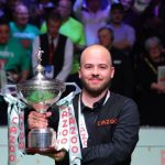 Luca Brecel of Belgium celebrates with the trophy after his final against Mark Selby of England at the World Snooker Championship in Sheffield, Britain, May 1, 2023. (Photo by Zhai Zheng/Xinhua/IANS)