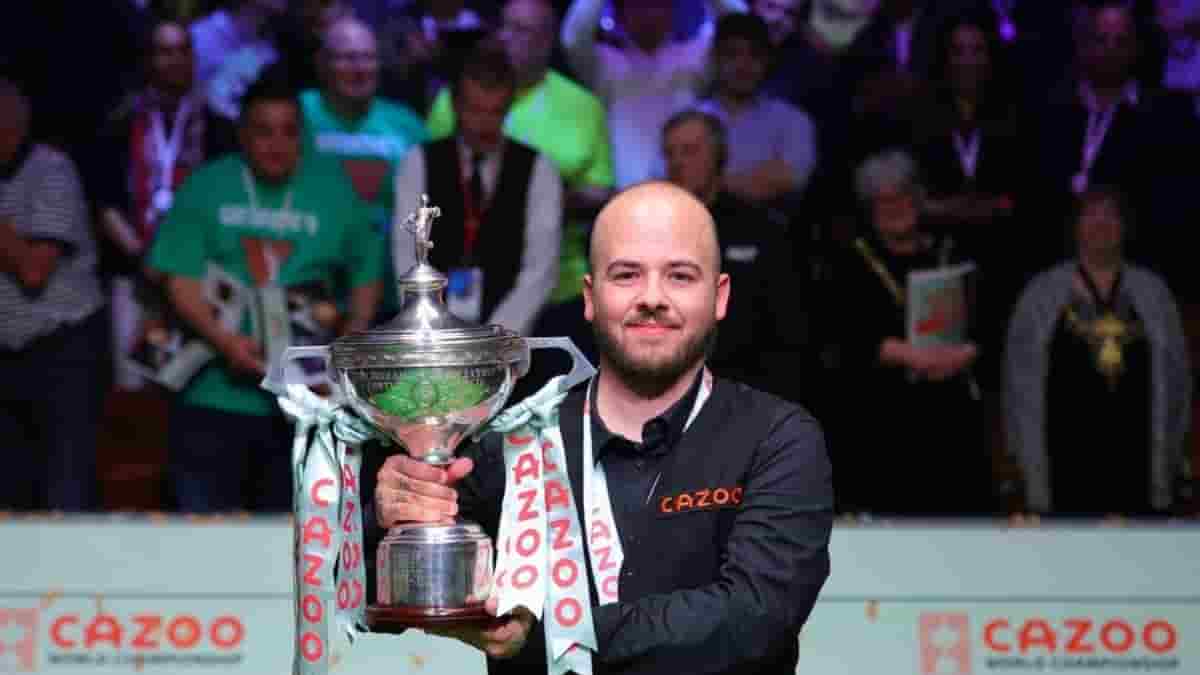 Luca Brecel of Belgium celebrates with the trophy after his final against Mark Selby of England at the World Snooker Championship in Sheffield, Britain, May 1, 2023. (Photo by Zhai Zheng/Xinhua/IANS)