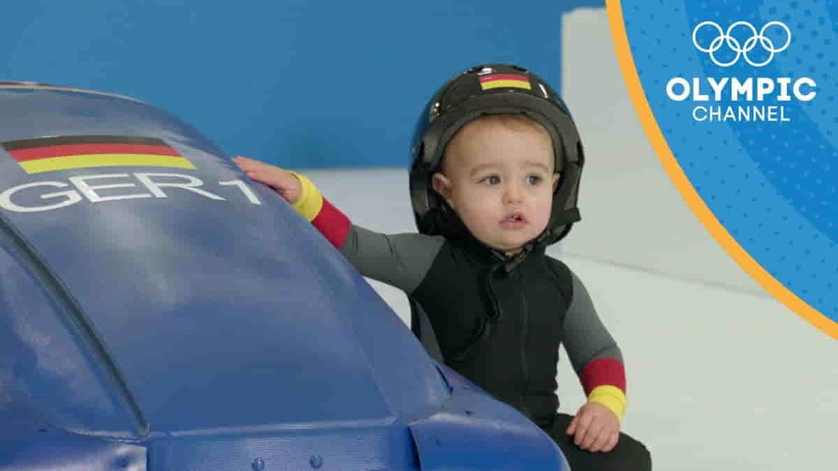 Babies playing in Baby Olympics events like crawling race and ball play – a fun celebration of growth and early learning through play.