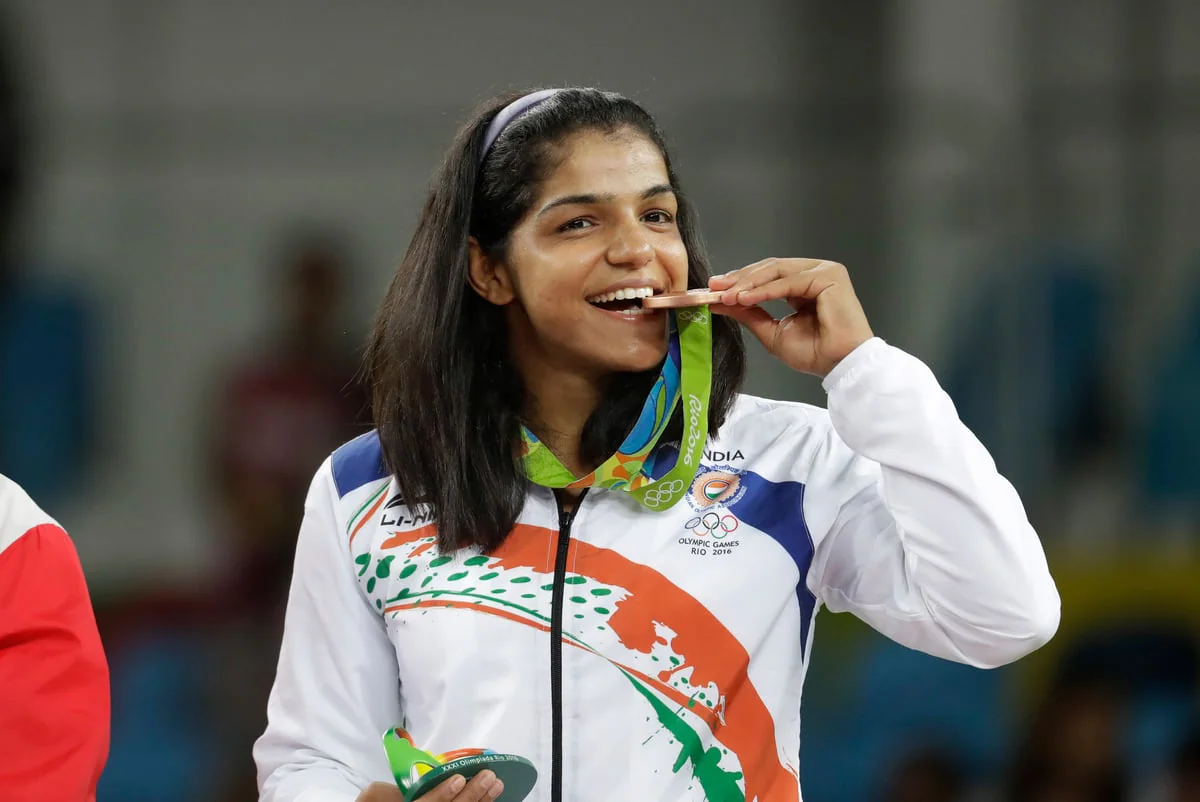 From Currency To Ritual: The History Of The Olympic Medal Bite