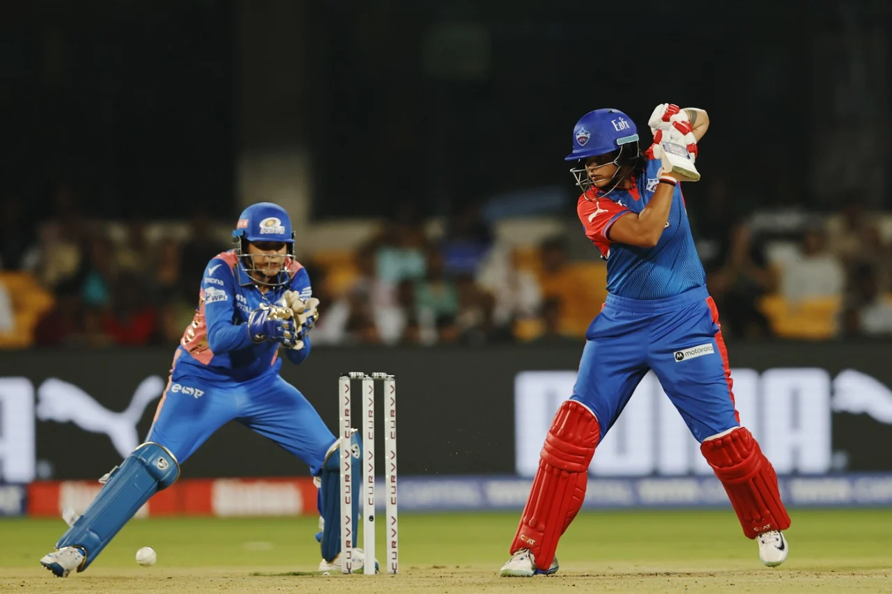 Shafali Verma hitting six, Delhi Capitals WPL match.